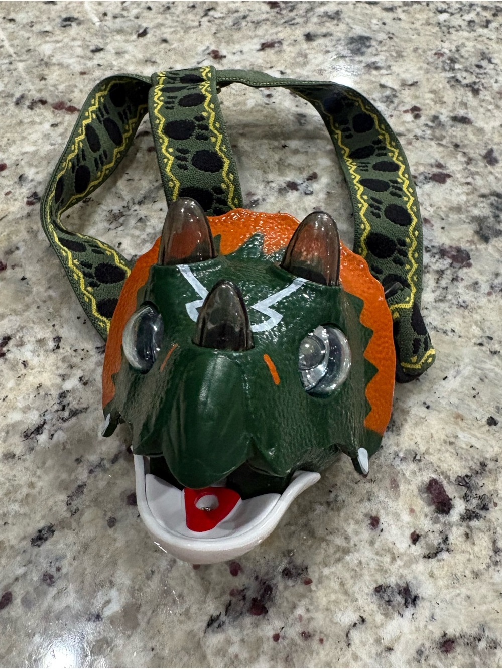 Kids dinosaur LED headlamp in good working condition